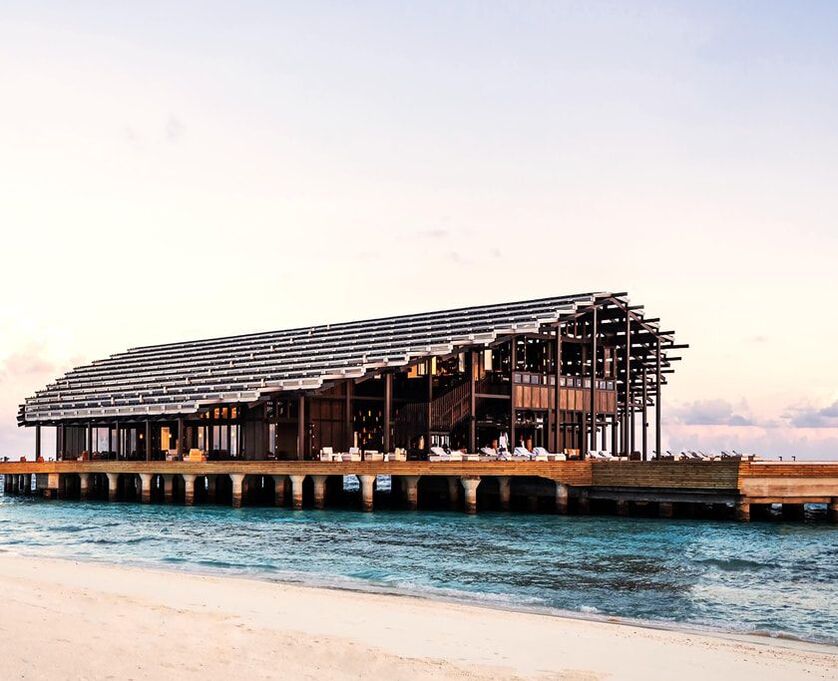 Solar panel clad building at the luxury over water Maldives resort Kudadoo