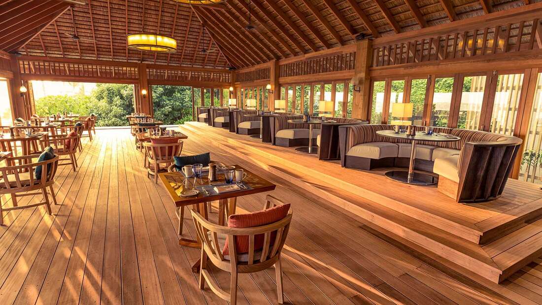 Tropical resort restaurant which opens up to nature and has Japanese inspired architecture