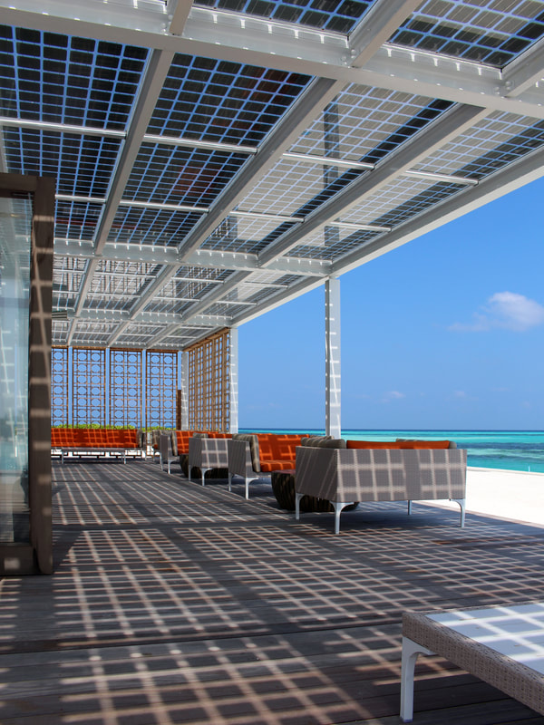 Luxury modern solar panel cabana at an ocean resort with Japanese inspired design.