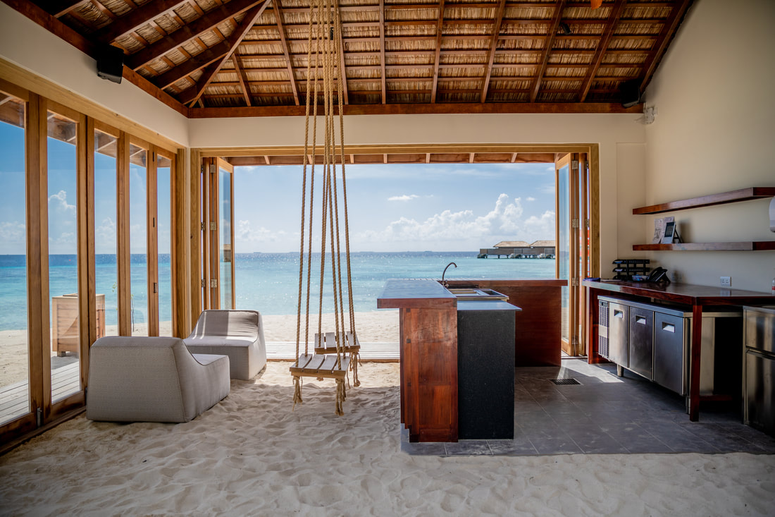 Luxury beach island resort sand bar with rope swing overlooking the pristine ocean