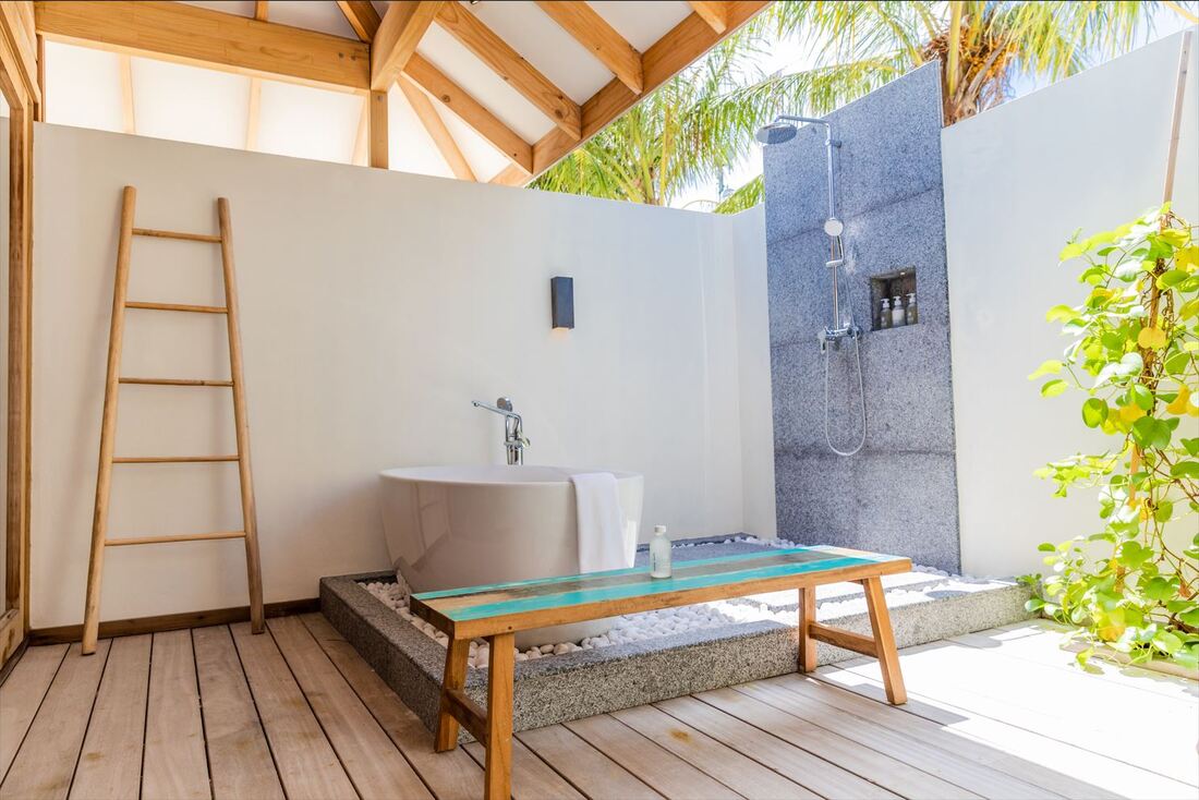 Luxury beach island resort villa with Japanese inspired natural architecture and modern outdoor shower and bathtub