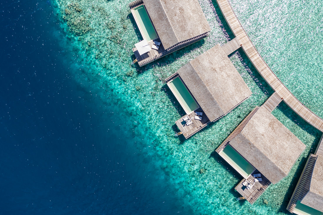 overhead of ocean villas along a coral reef