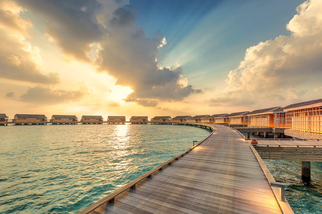 Ocean villas at sunset in the Maldives the hotel suites are arced 