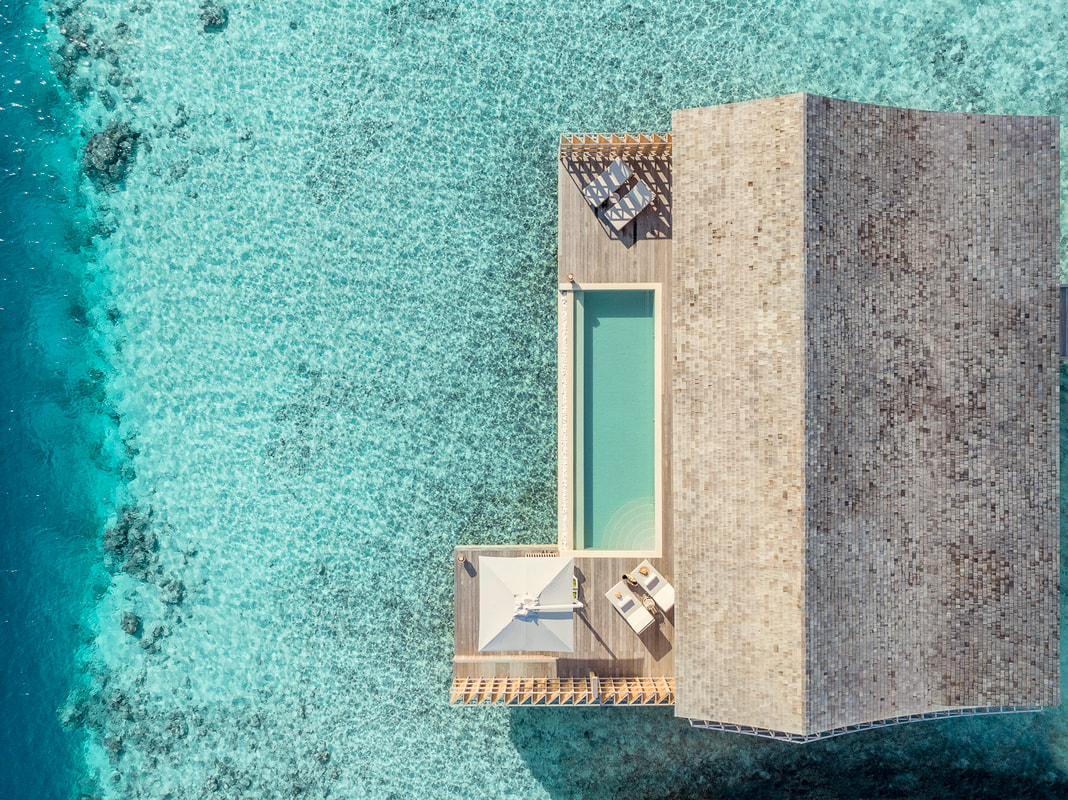 Over head view of an over water luxury villa in the Maldives 