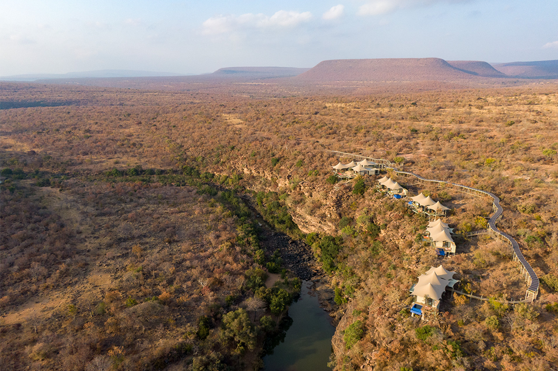 Expanse of south African safari lands with carbon offsetting luxury suits lay