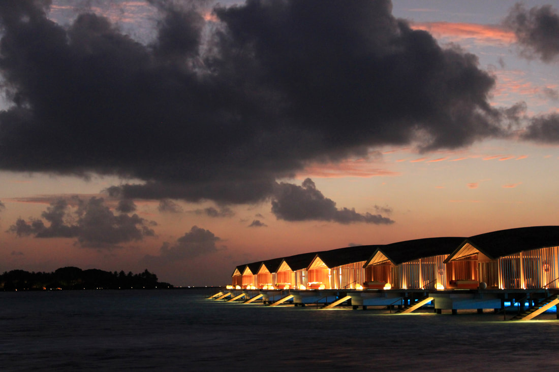luxury beach villas at night curved architecture 